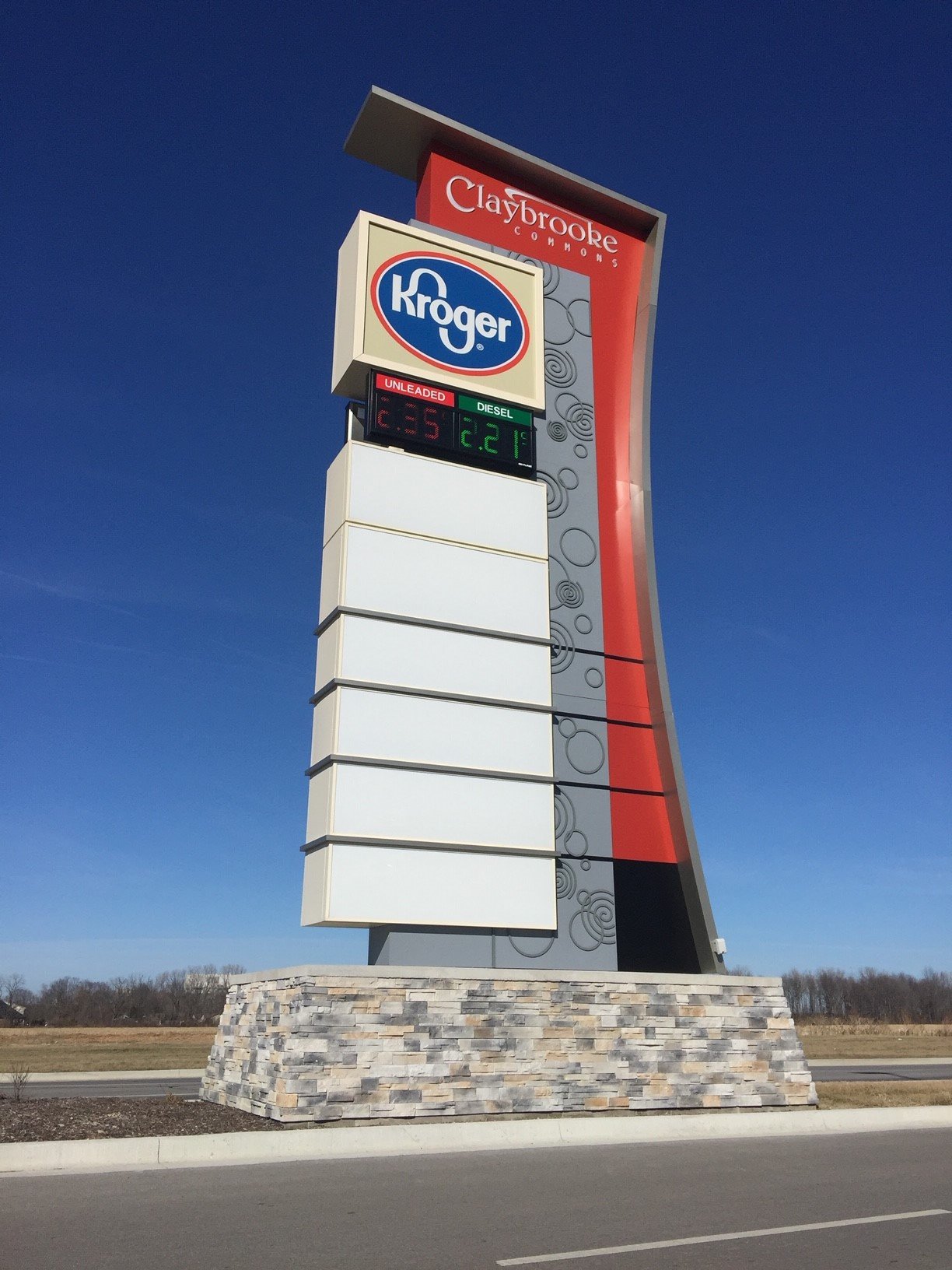 Large outdoor pylon sign board and illuminated commercial monument sign for corporate retail branding in Uganda
