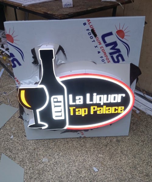 Custom 3D logo wall branding and illuminated indoor signage for La Liquor Tap Palace in Uganda