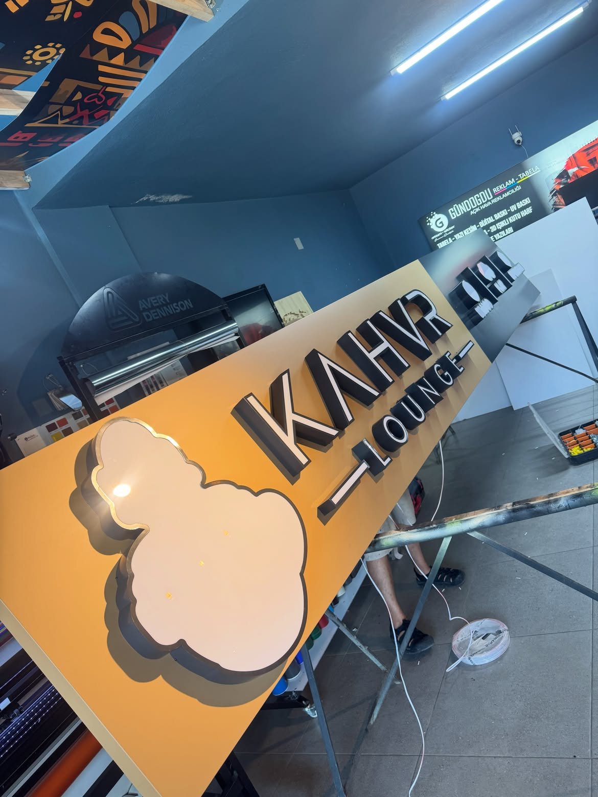 3D front-lit acrylic channel letters with anthracite powder-coated metal returns mounted on composite panel in Ntinda, Kampala, Uganda.