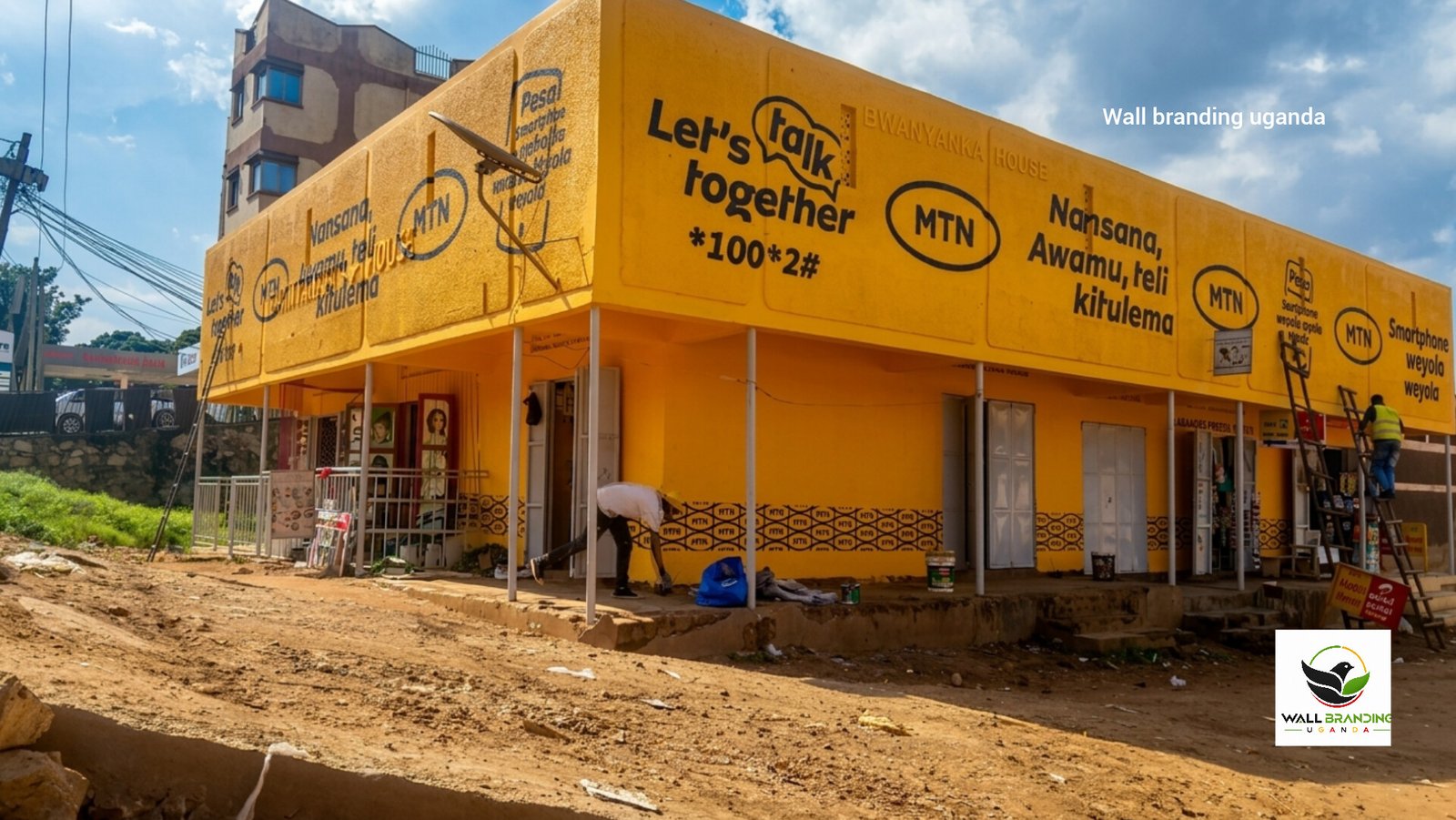 Large-scale wrap-around wall branding and commercial painting executed for MTN Uganda at Bwanyanka House, Nansana.