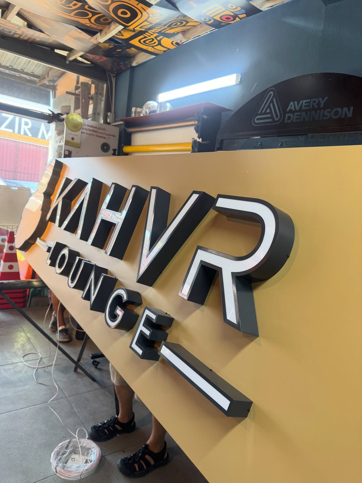3D front-lit acrylic channel letters with anthracite powder-coated metal returns mounted on composite panel in Ntinda, Kampala, Uganda.