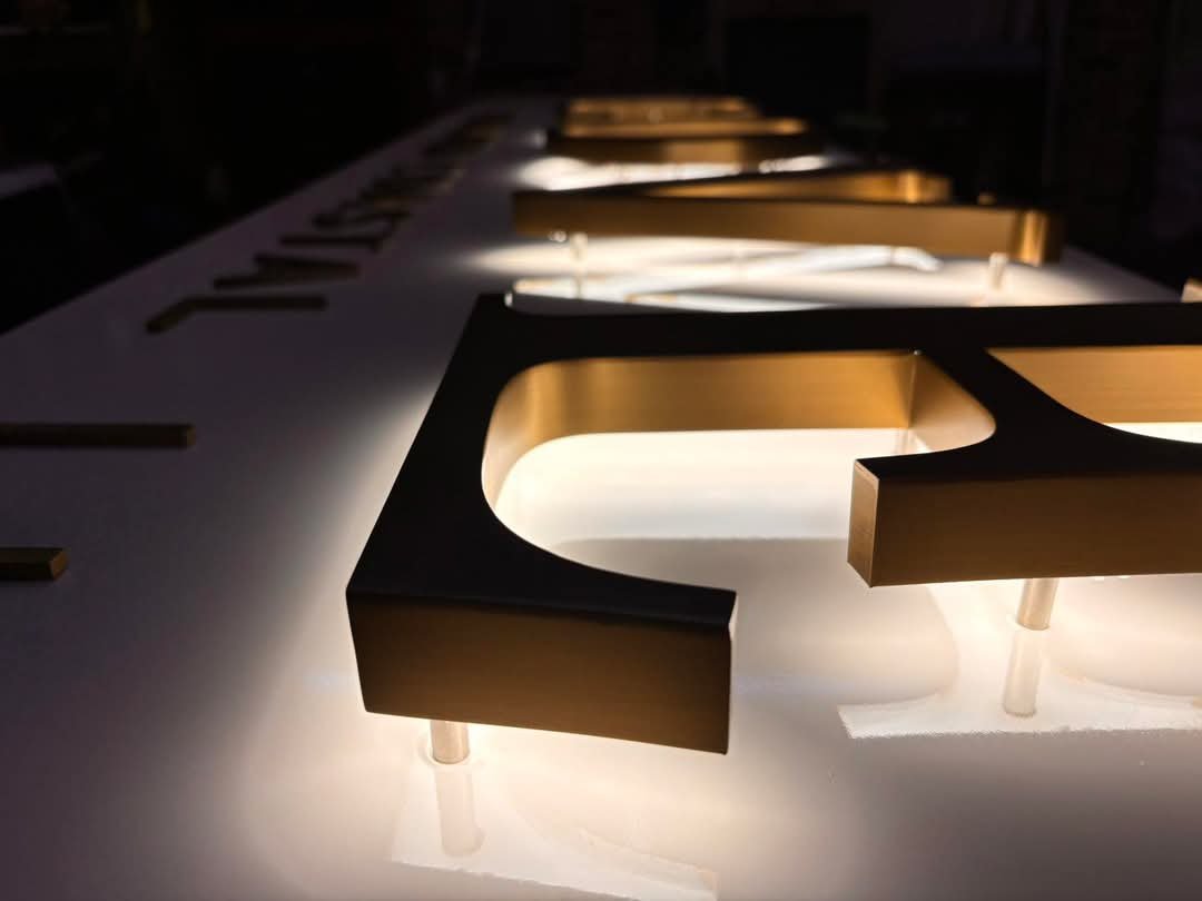 rushed Brass Halo-Lit Letters with Standoff Mounts